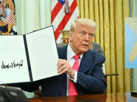 President Donald Trump signing an executive order in the Oval Office of the White House on March 6, 2025